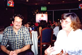 Roger's brother and Sister-in-law... Hank and Alice (In the background on the Big Screen TV is a 7 year old Kelly holding her baby brother Mark
