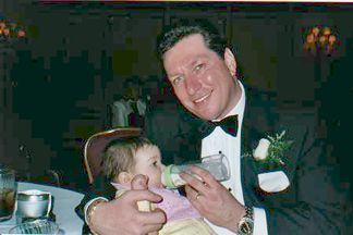 Kelly's Dad - Joe Heisler - feeding his little baby