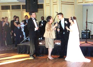 Debi and Greg Mattingly toasting Shaun and Kelly