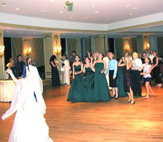 Kelly tosses the bouquet which was caught by Anika Milam (one of the bridesmaids)