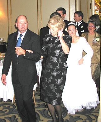Pat and Eve enter the room leading the Grand March.&nbsp; Bride, Groom and Parents follow