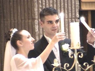Kelly and Shaun lighting the Unity Candle