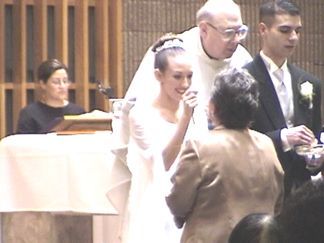 Kelly and Shaun giving Communion 