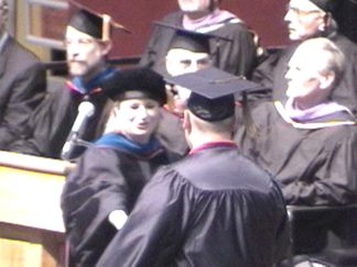 Getting his diploma