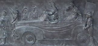 One of Many plaques along the WWII Memorial depecting patriotism from citizens at home and soldiers at the front