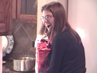 Natalie got caught sneaking a peek as one of the gifts *(Well..... sort of)
