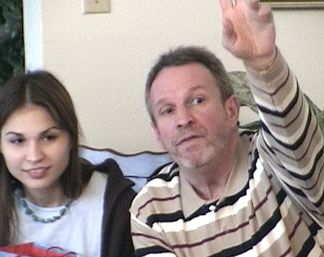 Nicole and Mike Stryk - Mike's asking questions about the rules for the White Elephant gift Exchange
